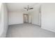 Large bedroom with neutral carpet, fan, and ensuite access at 2930 E Quiet Hollow Ln, Phoenix, AZ 85024