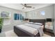 Bedroom with a ceiling fan, double windows, and calming decor at 2930 E Quiet Hollow Ln, Phoenix, AZ 85024