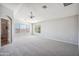 Spacious bedroom with neutral carpet, fan, and large windows at 2930 E Quiet Hollow Ln, Phoenix, AZ 85024
