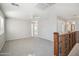 Large bonus room with neutral carpet, fan, and decorative railing at 2930 E Quiet Hollow Ln, Phoenix, AZ 85024