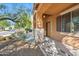 Covered front porch with decorative columns and desert landscaping at 2930 E Quiet Hollow Ln, Phoenix, AZ 85024
