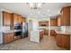 Beautiful kitchen features stainless steel appliances, granite counters and a central island at 2930 E Quiet Hollow Ln, Phoenix, AZ 85024
