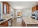 The open kitchen has granite counters, stainless appliances, and overlooks the outdoor patio at 2930 E Quiet Hollow Ln, Phoenix, AZ 85024
