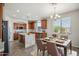 Eat-in kitchen with a large island, stainless steel appliances, and ample cabinet space at 2930 E Quiet Hollow Ln, Phoenix, AZ 85024