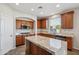 Spacious kitchen with granite countertops, stainless steel appliances, and island with breakfast bar at 2930 E Quiet Hollow Ln, Phoenix, AZ 85024