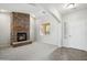 Cozy living room with a stone fireplace and an arched doorway at 2930 E Quiet Hollow Ln, Phoenix, AZ 85024