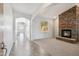 Bright living room featuring a stone fireplace and neutral carpet at 2930 E Quiet Hollow Ln, Phoenix, AZ 85024