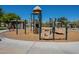 Community playground featuring climbing structures and other play activities for , surrounded by park at 2930 E Quiet Hollow Ln, Phoenix, AZ 85024