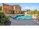 Backyard pool features flagstone surround, rock accents, and desert landscape at 2930 E Quiet Hollow Ln, Phoenix, AZ 85024