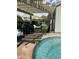 Backyard features a pool, patio with pergola, and artificial turf for relaxed outdoor living and enjoyment at 30440 N 42Nd Pl, Cave Creek, AZ 85331