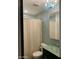 Bathroom showcases blue accent walls and wood-look flooring, featuring a shower behind a textured curtain at 30440 N 42Nd Pl, Cave Creek, AZ 85331