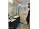 Bathroom features a modern shower with bench and dual shower heads and dual vanity at 30440 N 42Nd Pl, Cave Creek, AZ 85331