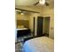 Bedroom with mirrored closet doors and wood-look flooring at 30440 N 42Nd Pl, Cave Creek, AZ 85331