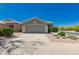 Charming single-story home featuring a well-maintained front yard and a two-car garage at 30440 N 42Nd Pl, Cave Creek, AZ 85331