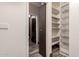 Hallway view to shelving and a toilet area at 30440 N 42Nd Pl, Cave Creek, AZ 85331