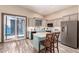 Well-lit kitchen features center island, stainless steel refrigerator, and access to balcony at 30440 N 42Nd Pl, Cave Creek, AZ 85331