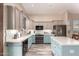 Bright kitchen featuring stainless steel appliances, island, and two-tone cabinets at 30440 N 42Nd Pl, Cave Creek, AZ 85331