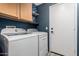 Laundry room with a washer, dryer, and cabinets at 30440 N 42Nd Pl, Cave Creek, AZ 85331