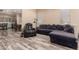 Comfortable living room featuring wood-style floors and a plush sectional sofa at 30440 N 42Nd Pl, Cave Creek, AZ 85331