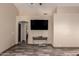 Spacious living room with wood-style floors, a TV, and neutral walls for a calming ambiance at 30440 N 42Nd Pl, Cave Creek, AZ 85331