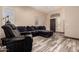 Inviting living room with tile floors, a sectional sofa, and natural light streaming through windows at 30440 N 42Nd Pl, Cave Creek, AZ 85331