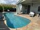 Backyard pool area is perfect for outdoor enjoyment, with covered patio and lush landscaping for a relaxing retreat at 30440 N 42Nd Pl, Cave Creek, AZ 85331