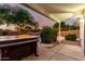 Covered patio with a hot tub offering views of the pool and tranquil landscaped backyard at 3152 N 83Rd Pl, Scottsdale, AZ 85251