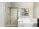Bright bathroom featuring a glass shower and a soaking tub at 3152 N 83Rd Pl, Scottsdale, AZ 85251