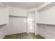 Walk-in closet featuring built-in shelving and ample storage space at 3152 N 83Rd Pl, Scottsdale, AZ 85251