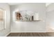 Open dining area adjacent to kitchen with a convenient pass-through and wood-look laminate flooring at 3152 N 83Rd Pl, Scottsdale, AZ 85251