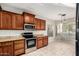 Well-lit kitchen features wooden cabinets, granite countertops, and stainless steel appliances at 3152 N 83Rd Pl, Scottsdale, AZ 85251