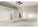 Spacious main bedroom featuring a ceiling fan, neutral walls, and carpet flooring at 3152 N 83Rd Pl, Scottsdale, AZ 85251