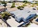 A high angle aerial view of the home showing the perimeter walls and neighboring homes at 32101 W Palo Verde St, Wittmann, AZ 85361