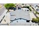 An elevated aerial view of the home showing the roof line, solar panels, and neighborhood at 32101 W Palo Verde St, Wittmann, AZ 85361
