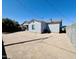 The backyard showcases desert landscaping, ensuring low upkeep and water conservation for homeowners at 32101 W Palo Verde St, Wittmann, AZ 85361