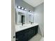 Bathroom with double sink vanity and modern lighting at 32101 W Palo Verde St, Wittmann, AZ 85361