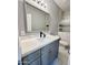 Bathroom featuring new vanity with sink, toilet, and glass-enclosed shower, all designed for a sleek design at 32101 W Palo Verde St, Wittmann, AZ 85361