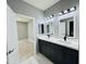 Bright bathroom featuring double vanity and modern fixtures at 32101 W Palo Verde St, Wittmann, AZ 85361