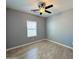 Well-lit bedroom featuring ceiling fan and neutral decor at 32101 W Palo Verde St, Wittmann, AZ 85361