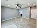 Open concept bedroom with ceiling fan, tile flooring and neutral decor at 32101 W Palo Verde St, Wittmann, AZ 85361
