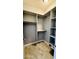 A walk-in closet boasts ample shelving and hanging space, offering efficient storage solutions at 32101 W Palo Verde St, Wittmann, AZ 85361