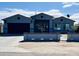 Charming home featuring a well-maintained exterior with a driveway and landscaped yard at 32101 W Palo Verde St, Wittmann, AZ 85361