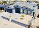 Beautiful one-story home with gray accent trim and an attractive landscaped front yard, featuring an attached garage at 32101 W Palo Verde St, Wittmann, AZ 85361
