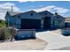 Stylish single-Gathering home with a well-manicured lawn, showcasing modern architectural details at 32101 W Palo Verde St, Wittmann, AZ 85361