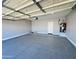 Garage with epoxy flooring and a water heater adds value and functionality to the home at 32101 W Palo Verde St, Wittmann, AZ 85361