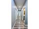 Hallway with gray walls and wood-look floors at 32101 W Palo Verde St, Wittmann, AZ 85361