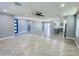 Bright open-concept living space featuring tile floors, LVP floors, and a modern kitchen at 32101 W Palo Verde St, Wittmann, AZ 85361