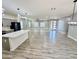 Open-concept living room and kitchen space with modern lighting and wood-look floors at 32101 W Palo Verde St, Wittmann, AZ 85361