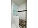 Modern shower with glass partition and mosaic tile accents at 32101 W Palo Verde St, Wittmann, AZ 85361