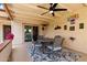 Cozy covered patio with a ceiling fan, dining set, and access to the home's interior at 34 Leisure World --, Mesa, AZ 85206